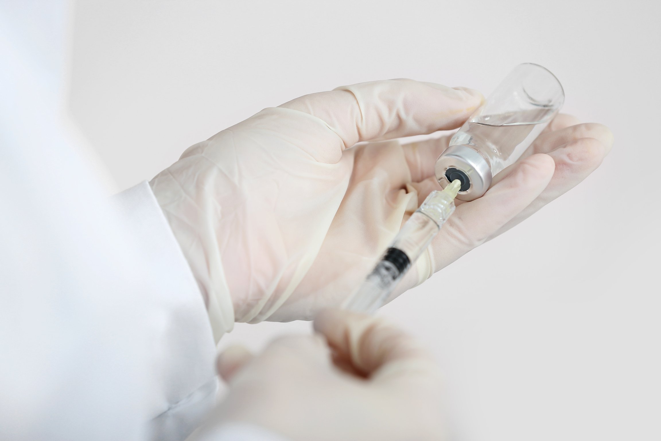 Cosmetologist with Syringe and Ampule with Filler, Closeup